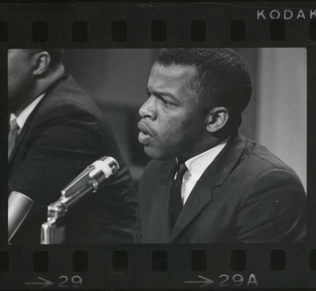 View of John Lewis, the director of the Southern Regional Council's Voter Education Project, encouraging voter participation in downtown Atlanta, Georgia ca. 1973.