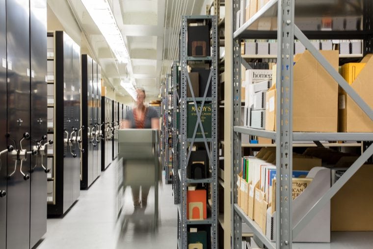 blurred woman, going through the museum artifacts