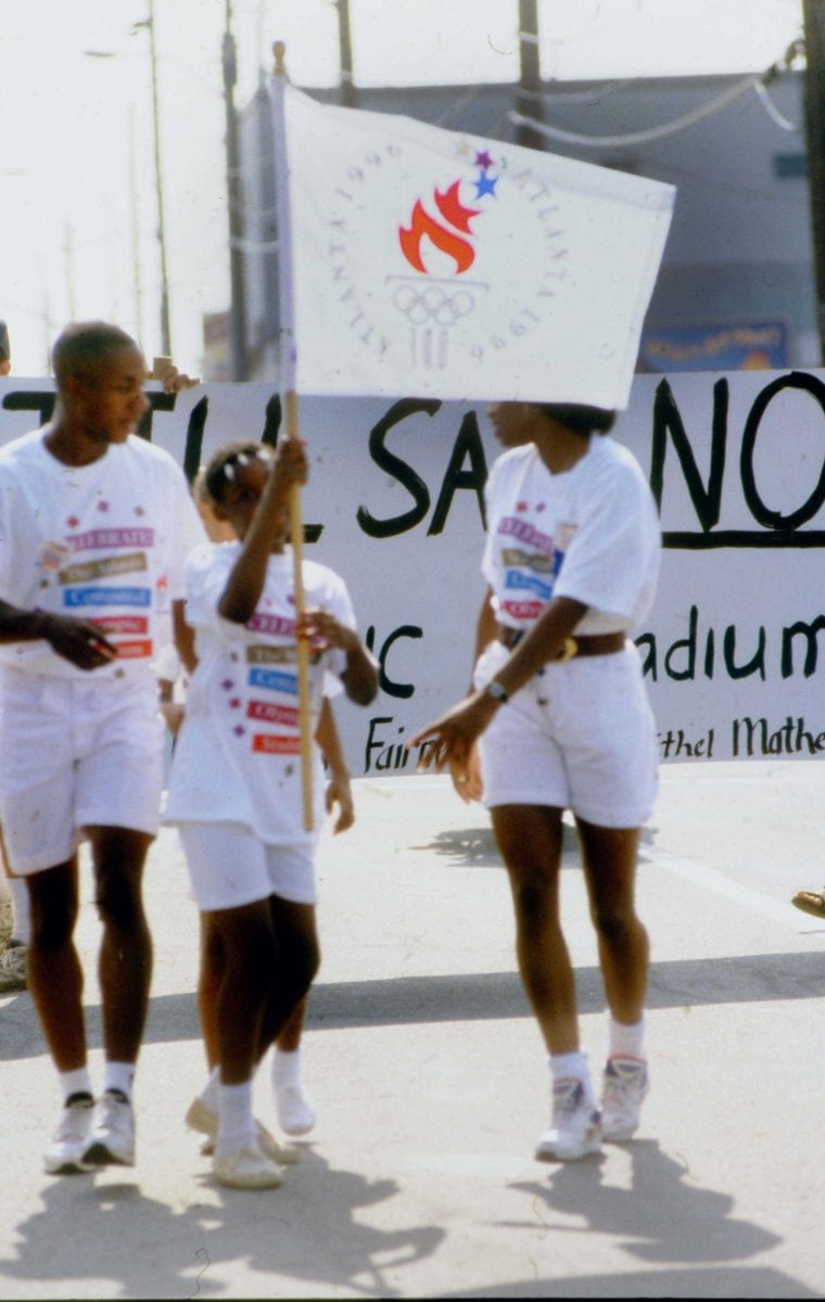 Ceremonial Runners in Front of ANUFF Protestors at Centennial Olympic Stadium Groundbreaking Event