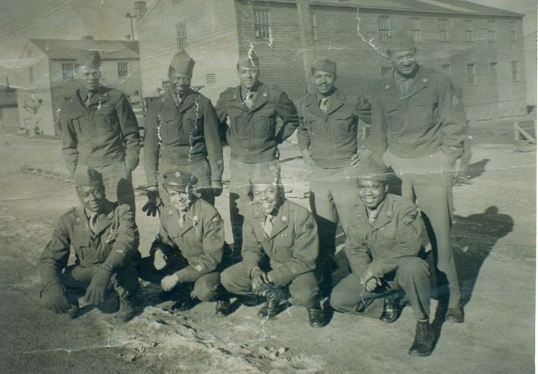 Lewis S. Conn (top row, center) stands with his unit. 