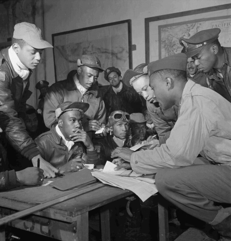 Tuskegee Airmen strategize in Ramitelli, Italy, March 1945. Image via Library of Congress.