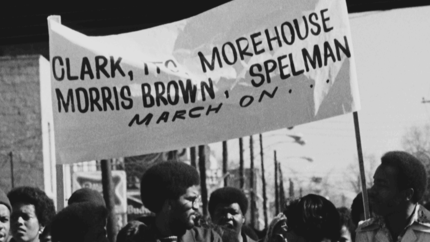 Students march down Auburn Avenue commemorating Martin Luther King, Jr.'s 47th birthday, January 15, 1976.