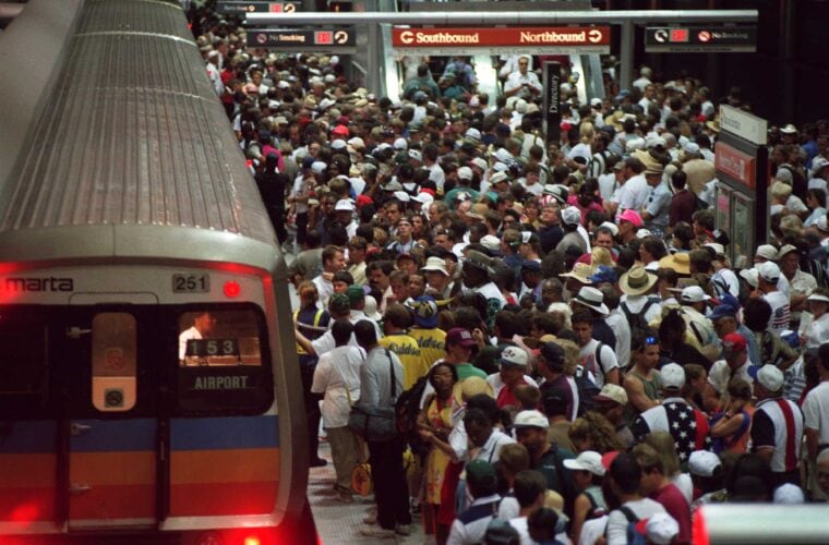 Crowd of people waiting to get on subway train