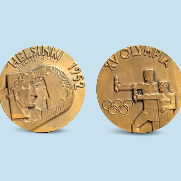 Gold medals with one side that has two faces and says Helskinki 1952 and the opposite two men holding torches, Olympic rings and XV Olympia