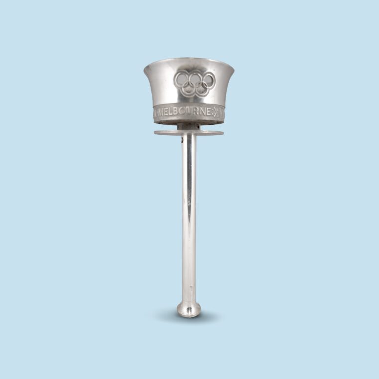 Silver torch with cup-like top on blue background