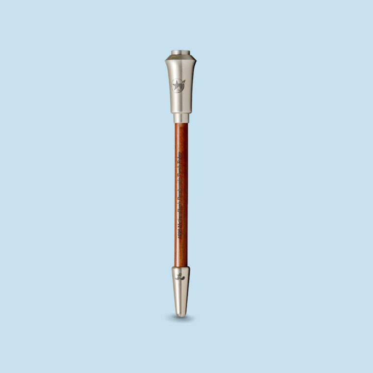 Silver and cherry wood torch on blue background