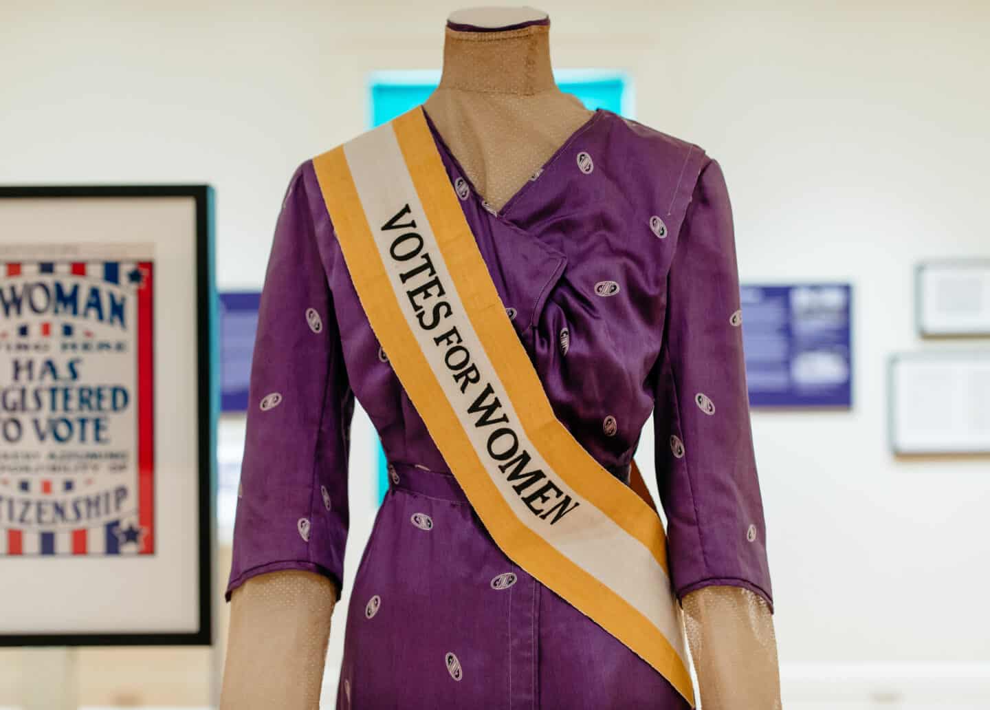 votes for women sash and purple dress