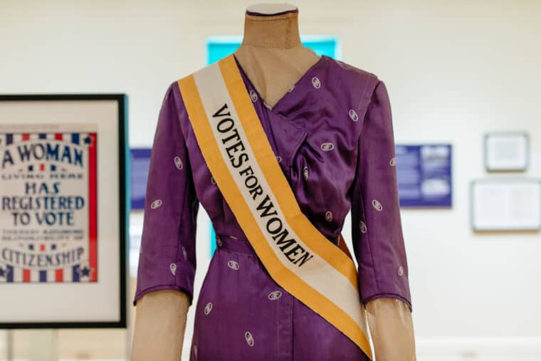 votes for women sash and purple dress
