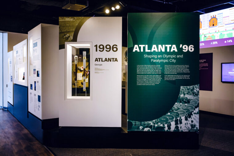 Green and white exhibition panels that say 1996 Atlanta and Atlanta '96