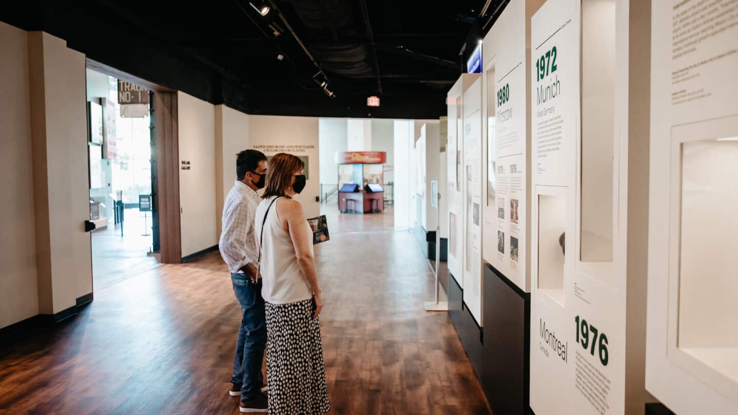 Guests looking at olympics exhibit at History After Hours event