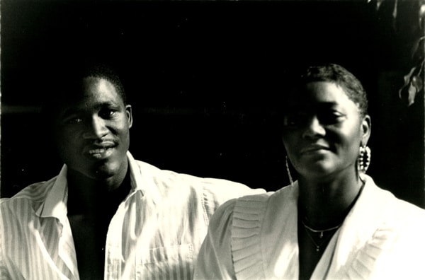 archival photo , man and woman in white clothing