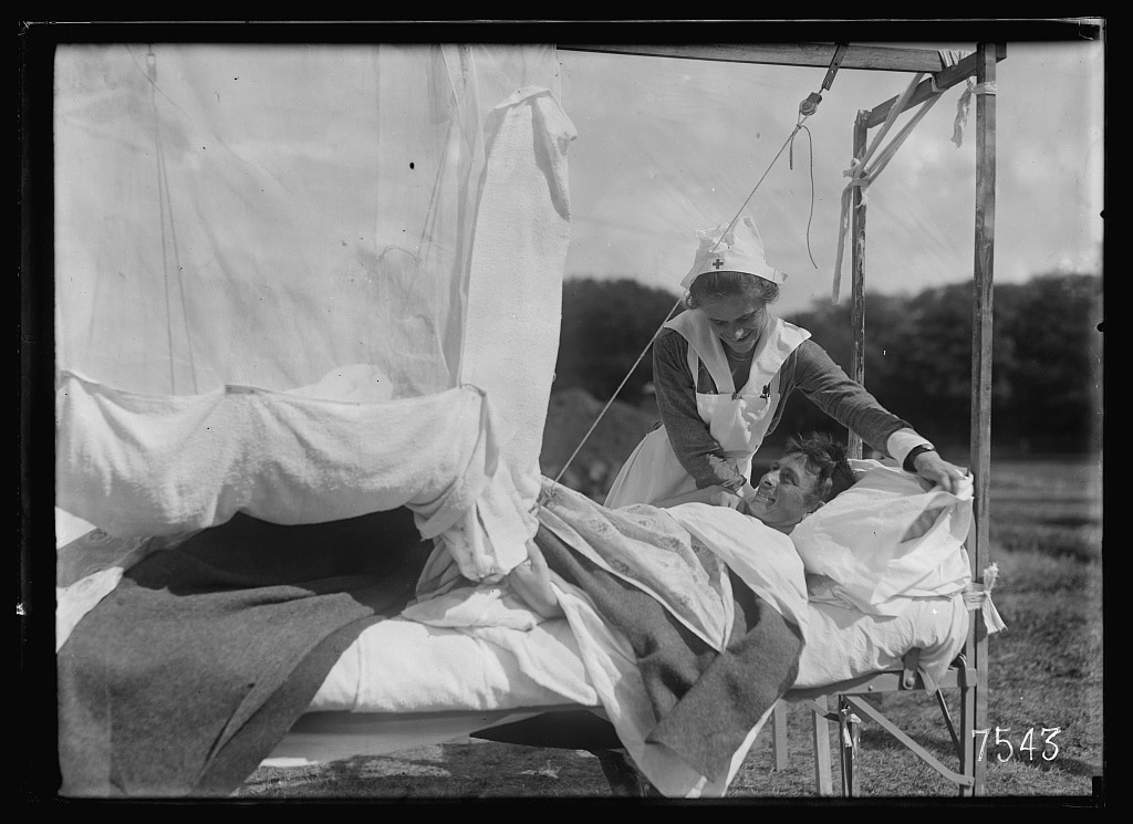 Female nurse caring for male patient