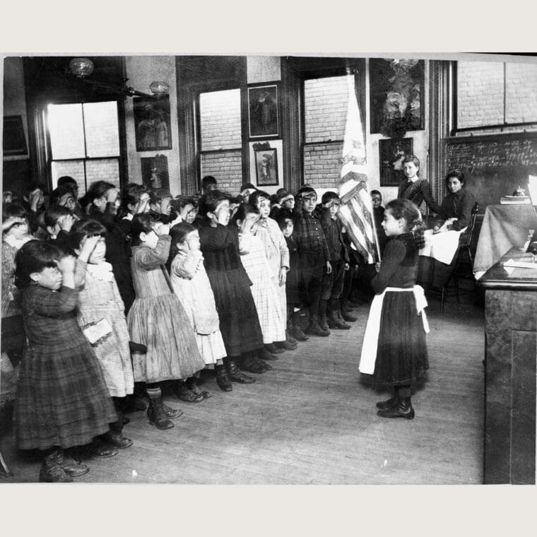 Students in Mott Street Industrial School salute the flag