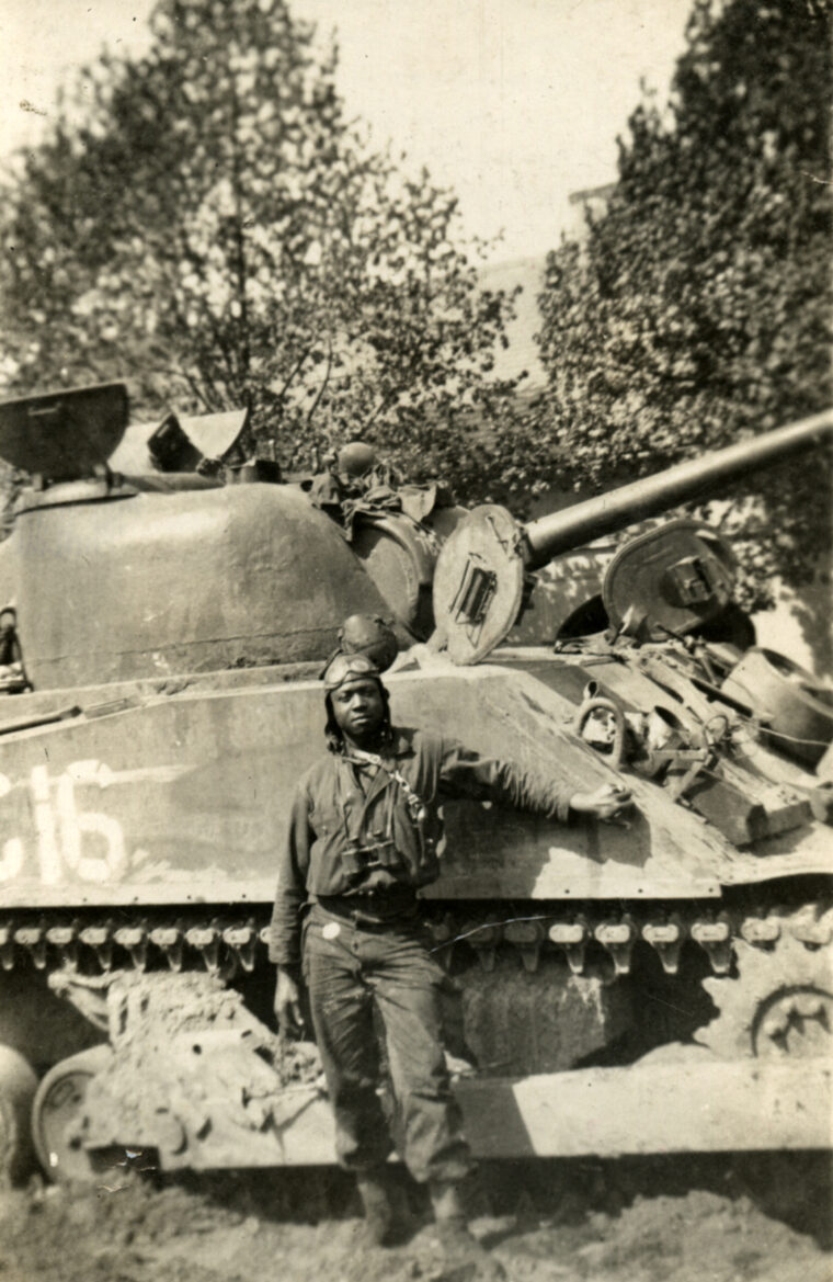 Aldophus Walker in front of tank