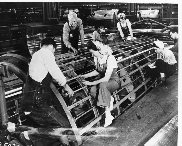 Men and women workers at the Bell Bomber plant in Marietta, Georgia
