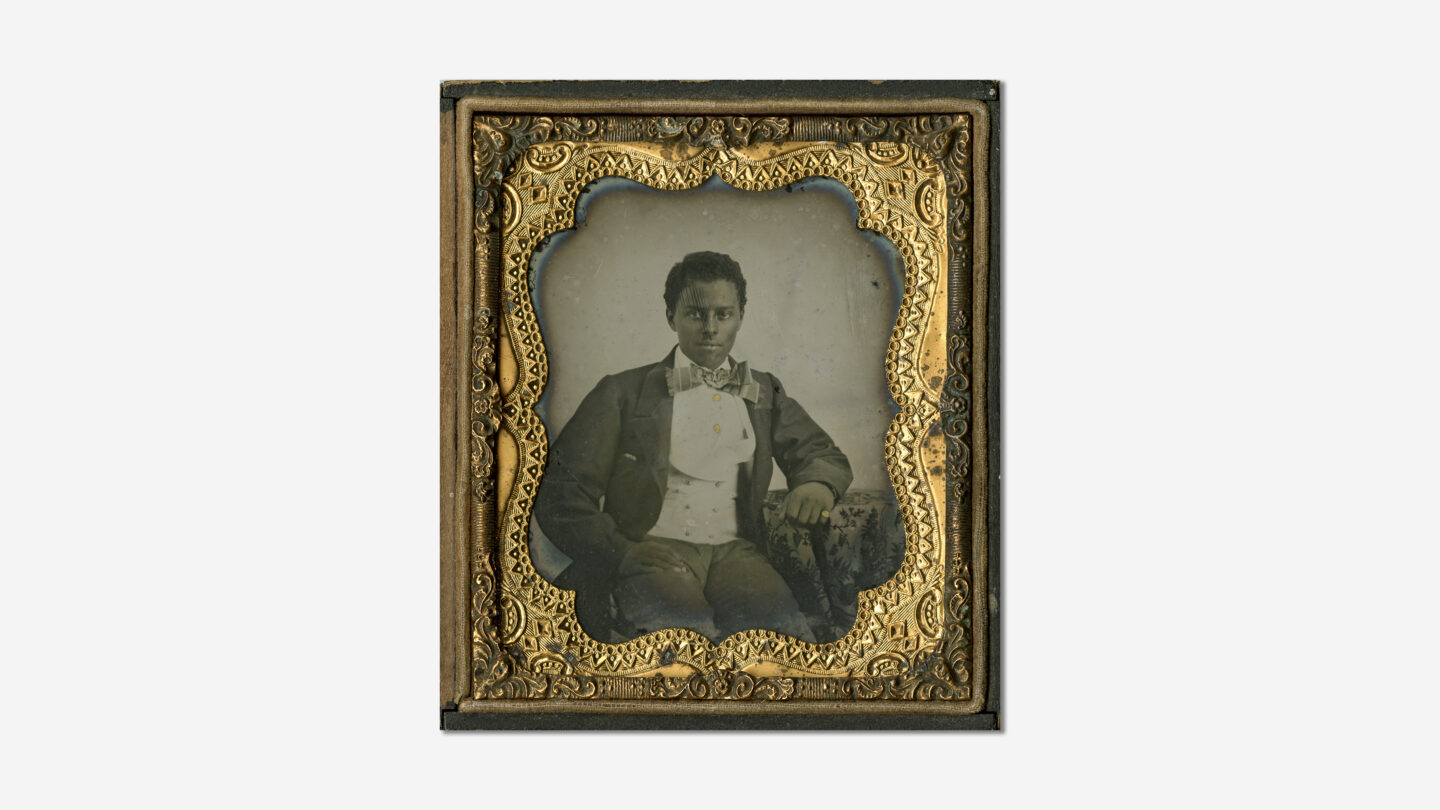 A seated Solomon Luckie poses for a photograph