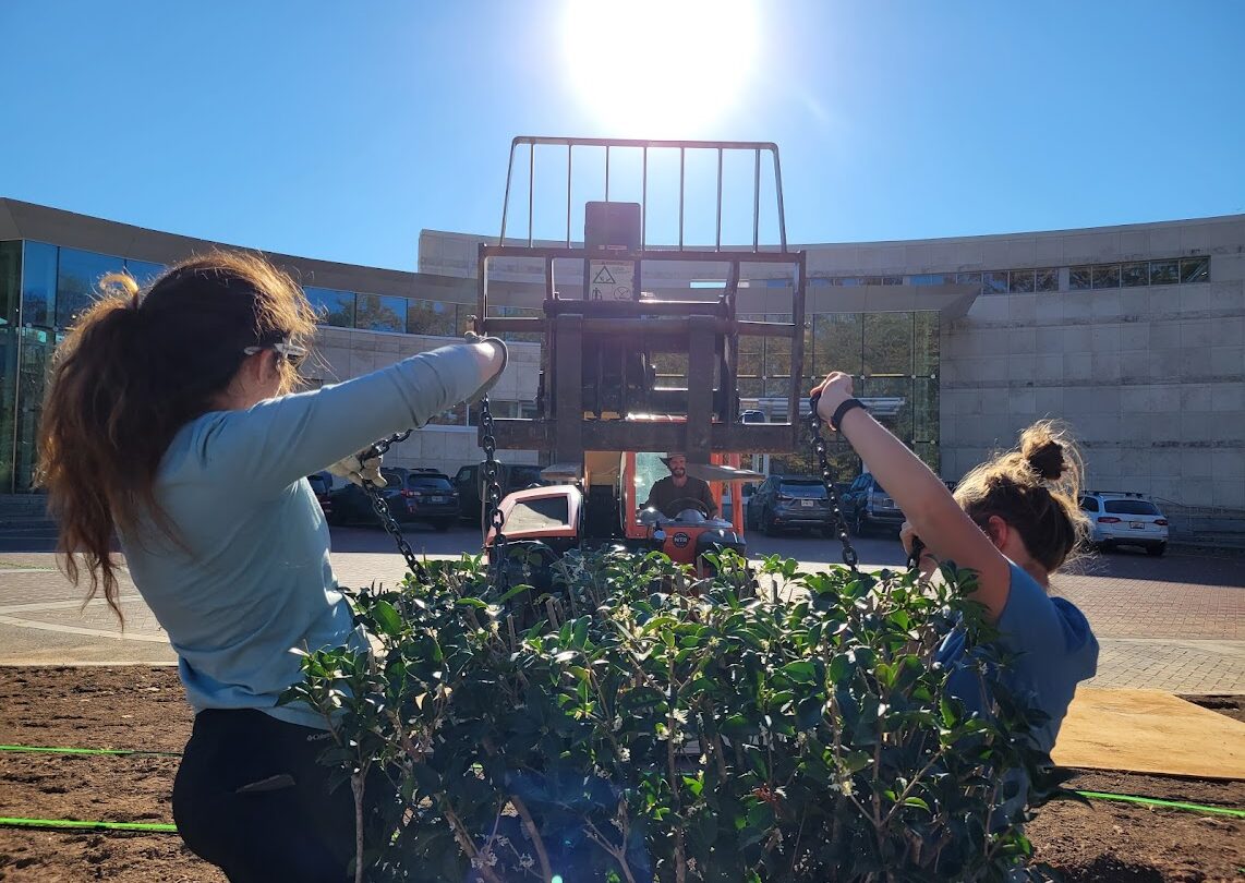 Madison Love, Travis Fisher, and Cameron Wethern working on the Front Entrance Garden expansion project.