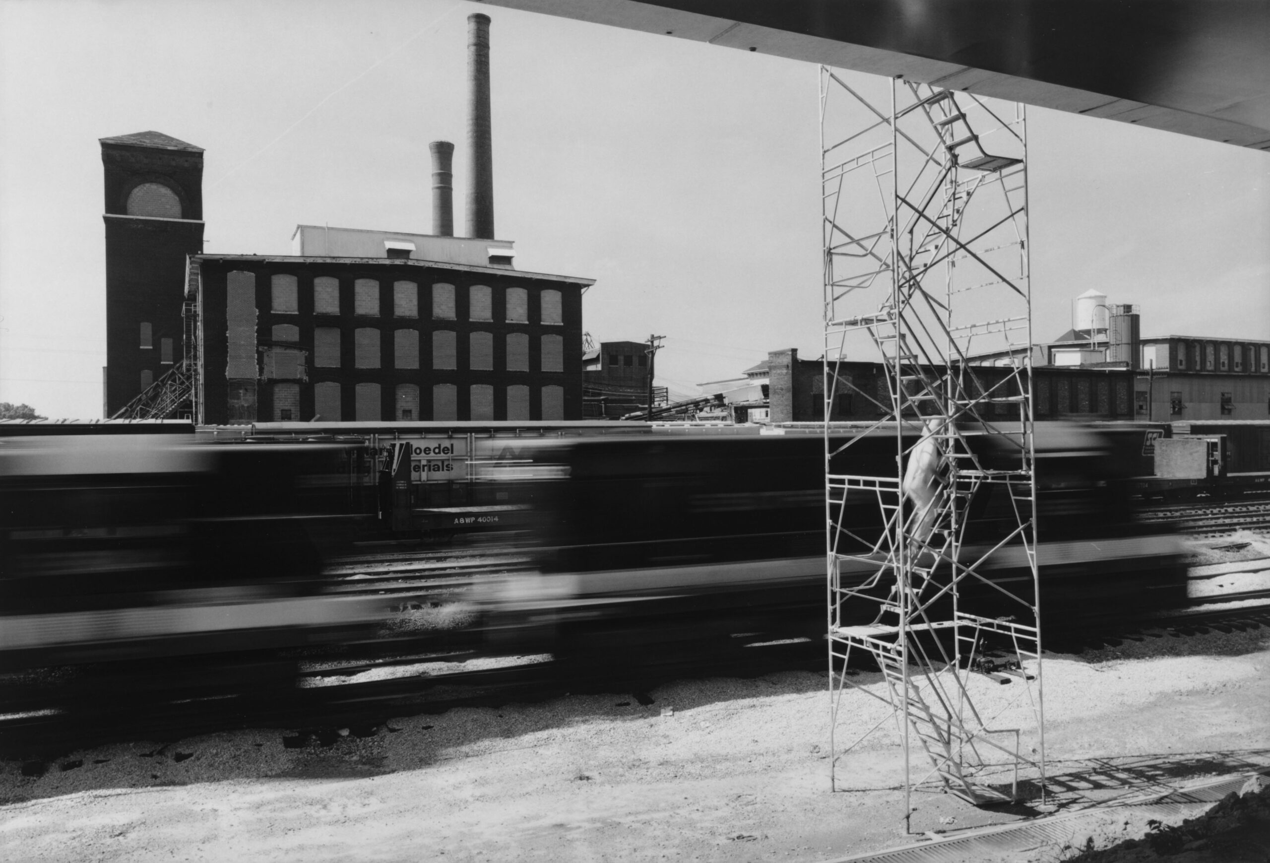 View of the Fulton Bag and Cotton Mill and trains as seen from the construction of MARTA's East Line circa 1977