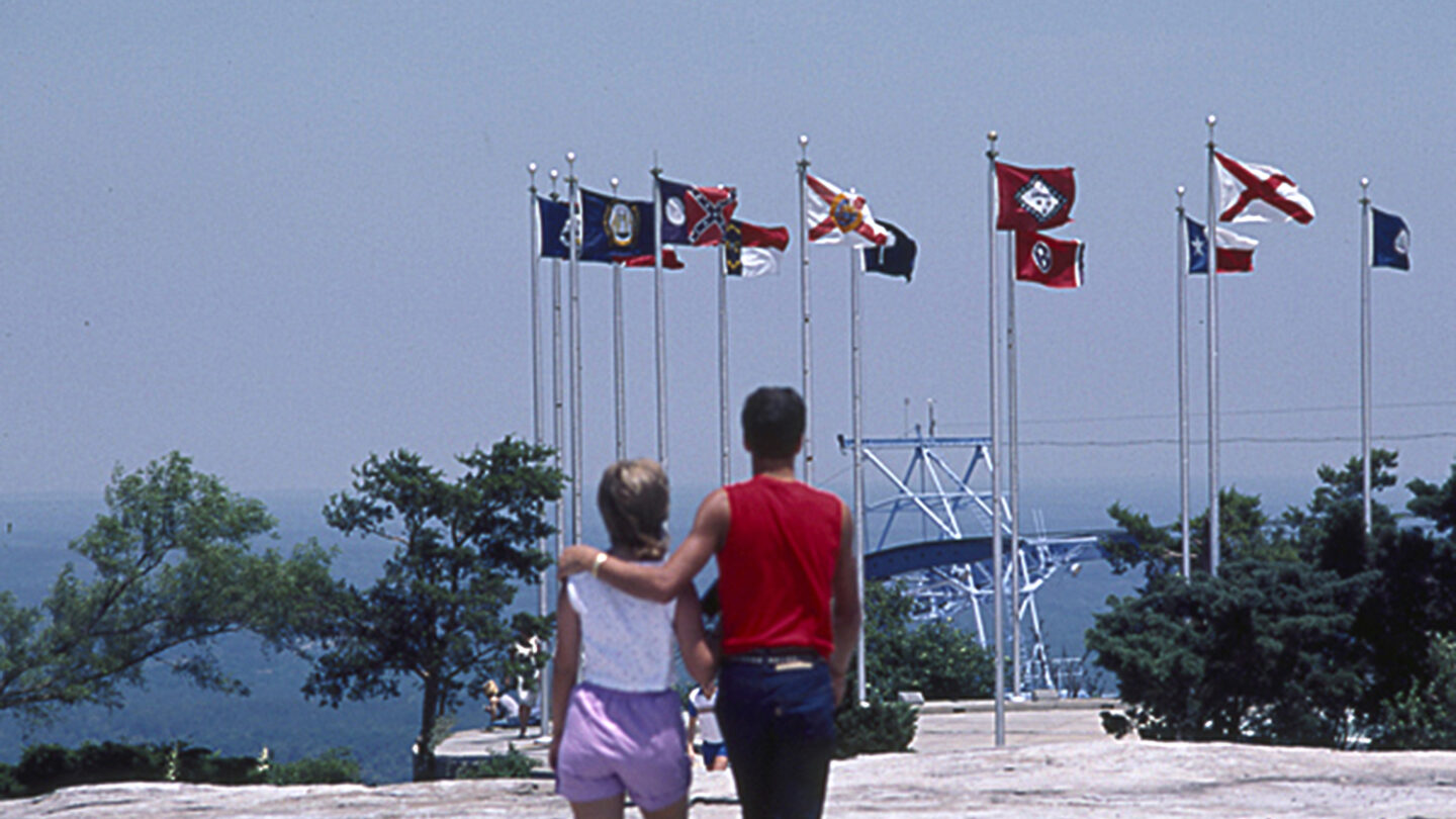 Visitors on top of Stone Mountain look out at the flag terrace, circa 1990