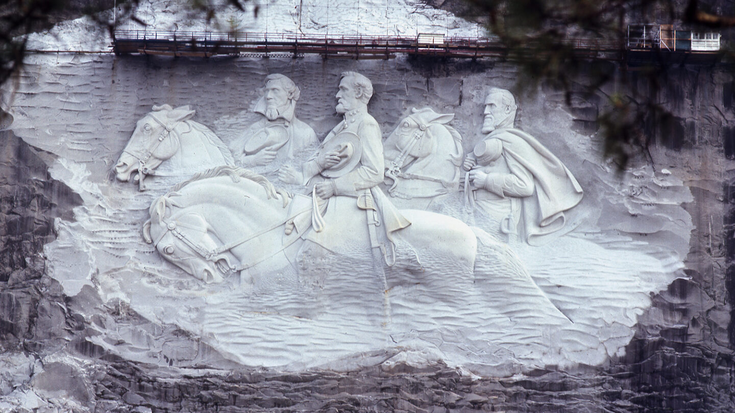 The Stone Mountain carving features Confederate figures Jefferson Davis, Robert E. Lee, and Thomas Jonathan “Stonewall” Jackson.