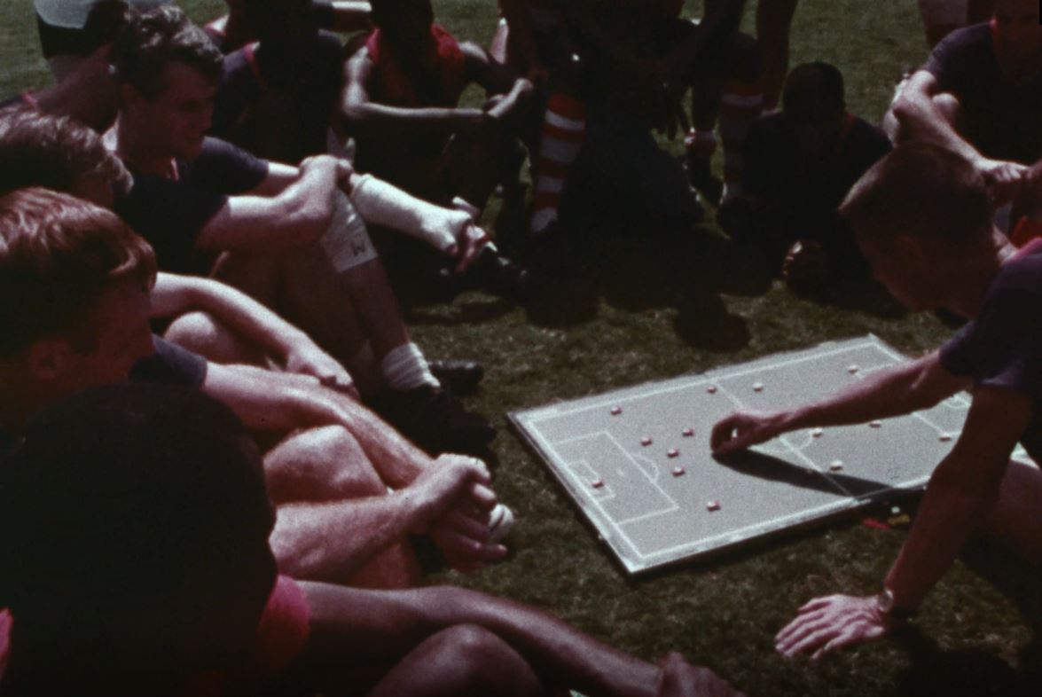 soccer players discussing about game strategy