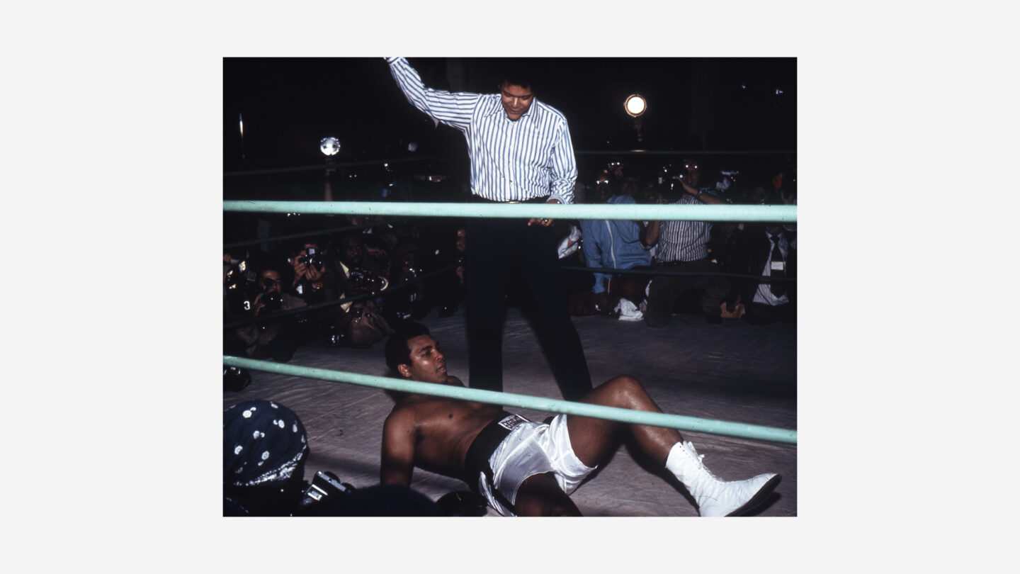 Civil rights leader Julian Bond, acting as referee, counts out Muhammad Ali in an exhibition fight against Mayor Maynard Jackson