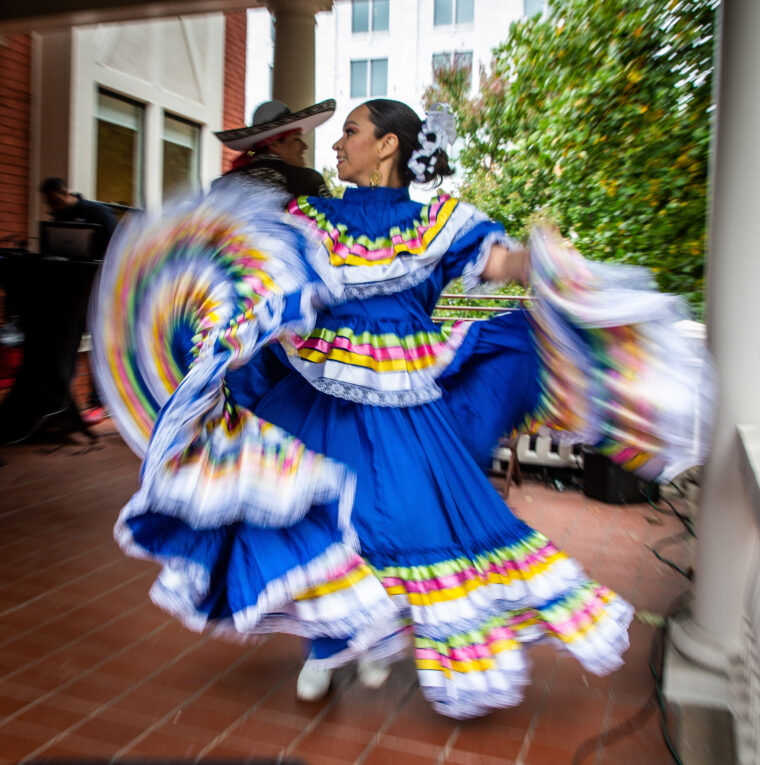 A woman dances during a Day of the Dead celebration