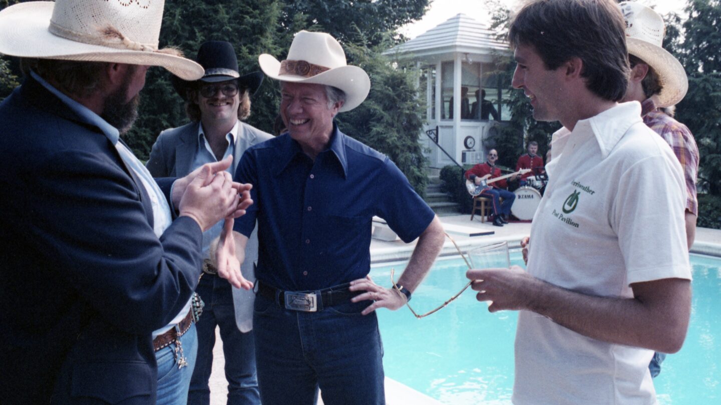 President Carter talking to two people