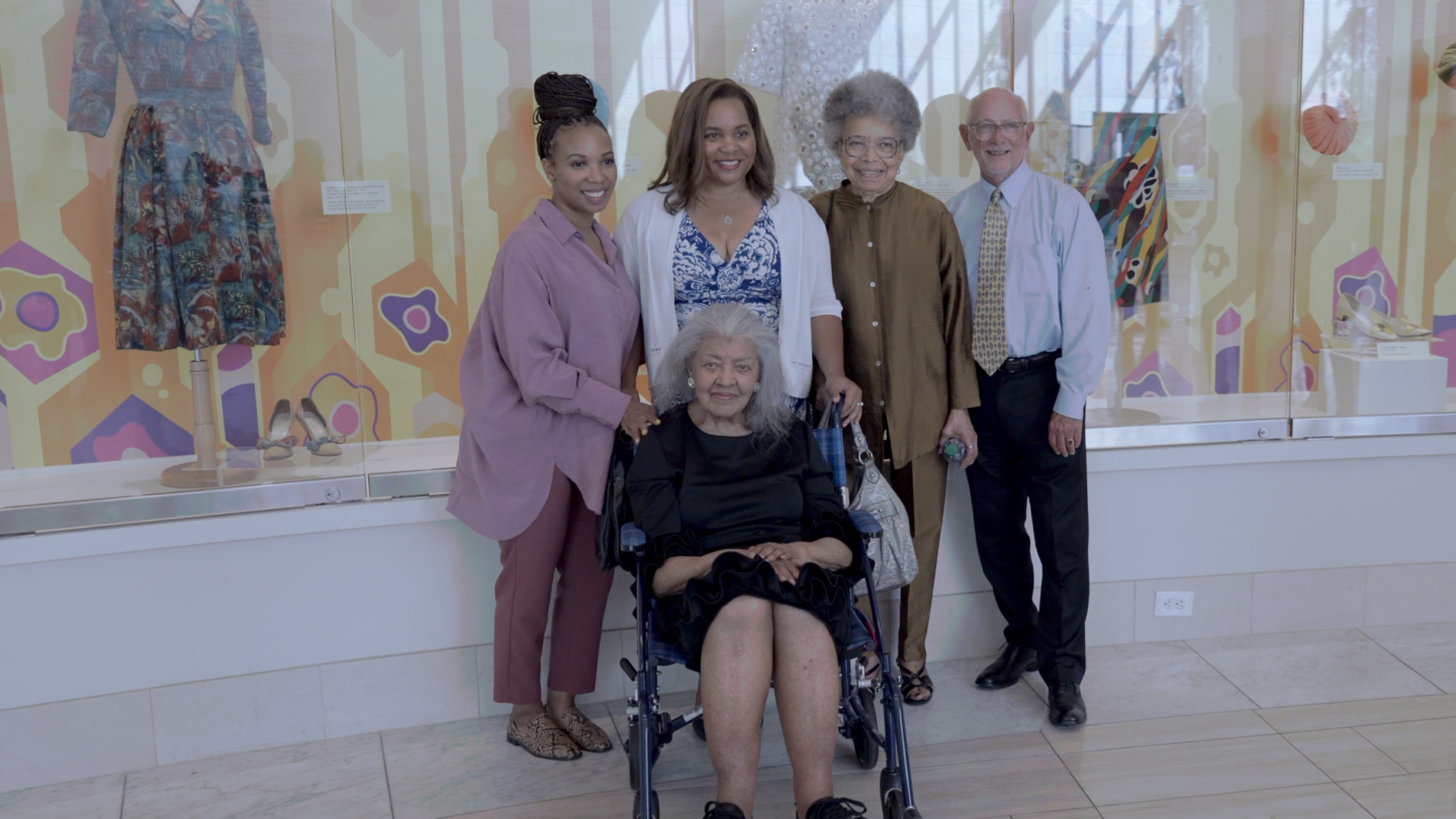 Ann Moore posing with a group of people