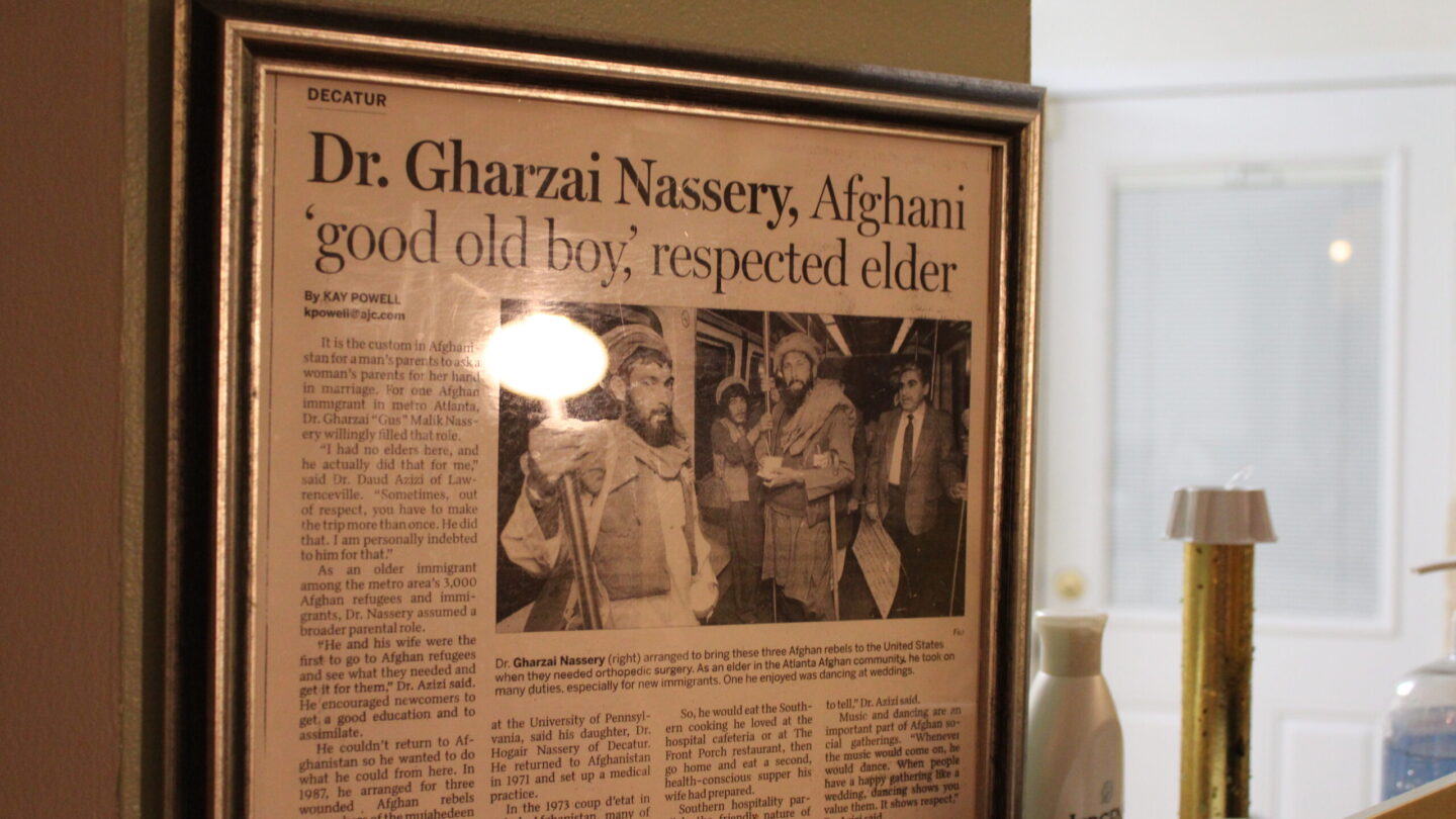 The obituary of Dr. Gharzai Nassery that hangs in Mariam's home
