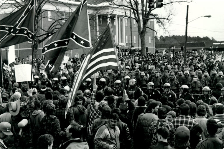 Counter-protesters gather in front of the Cumming Courthouse