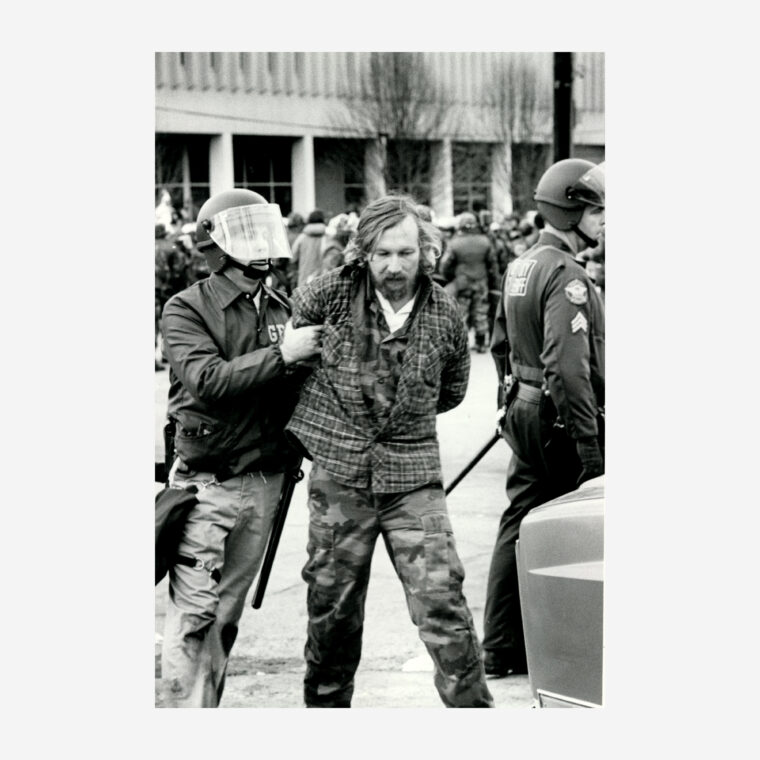 Members of the Georgia Bureau of Investigations detain a man during the Brotherhood March