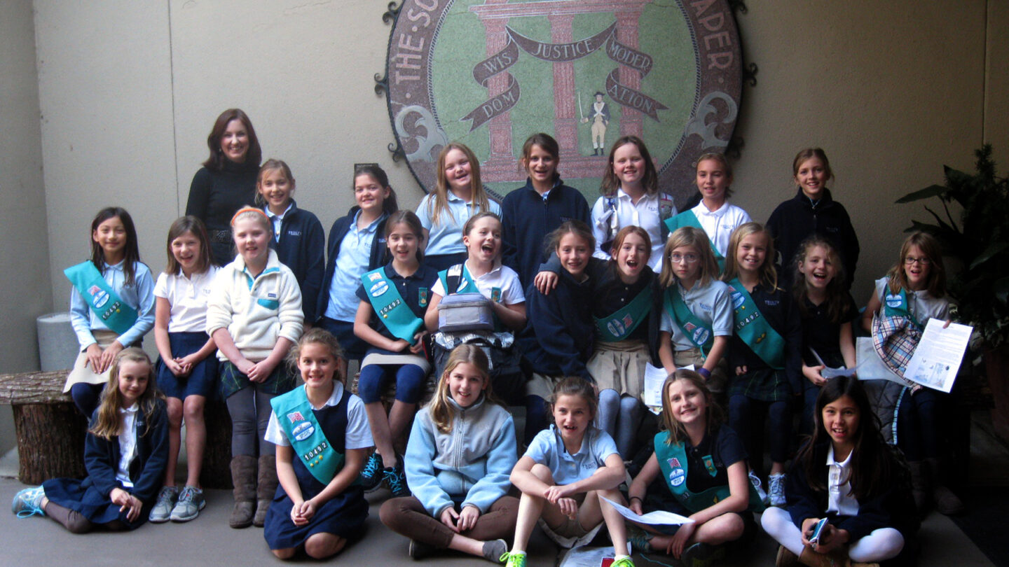 Staci with Girl Scouts outside of McElreath Hall in 2011.