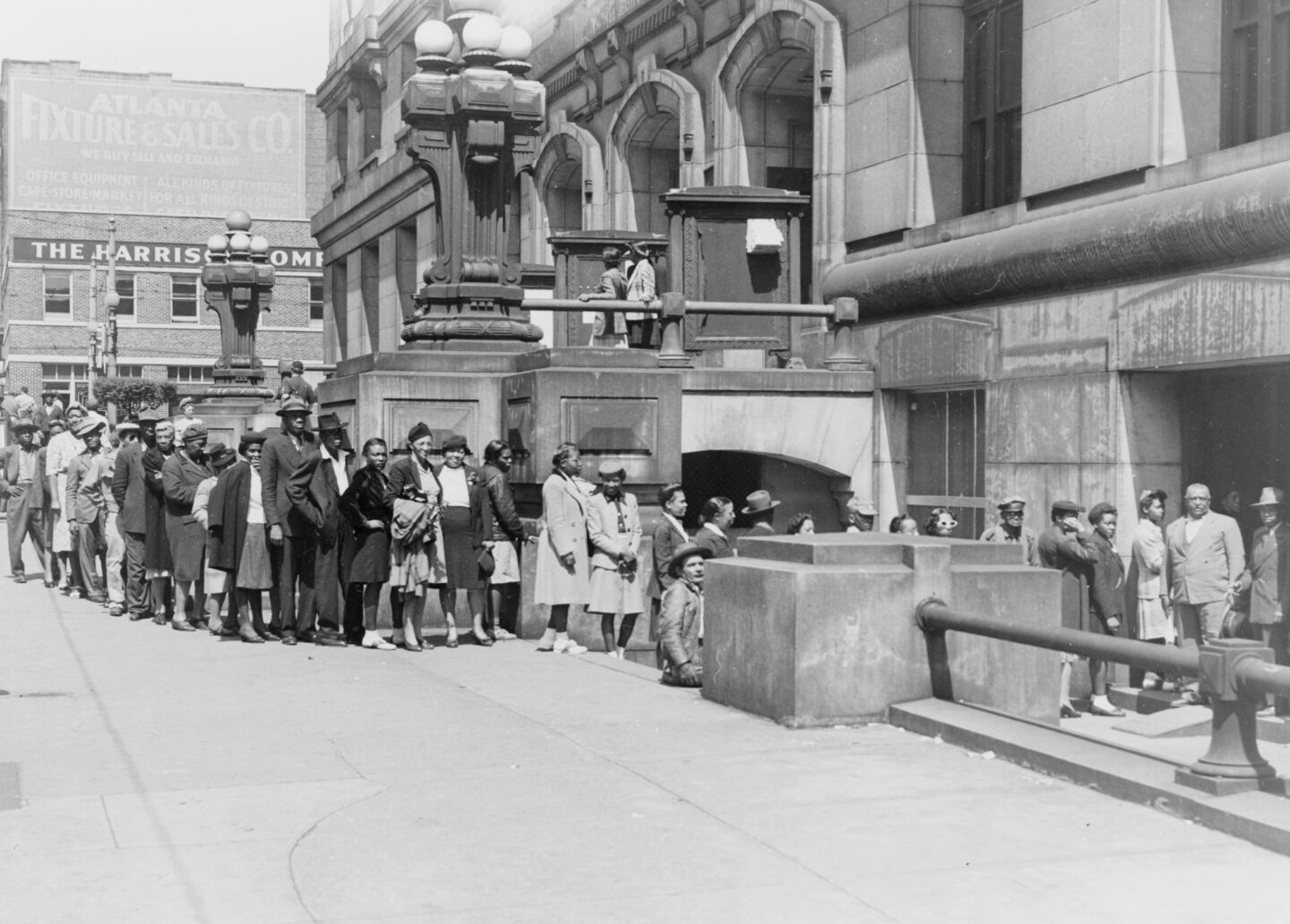African Americans stand in front of the Fulton County Courthouse in Atlanta to register to vote, 1946
