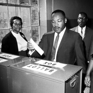 MLK putting ballot in