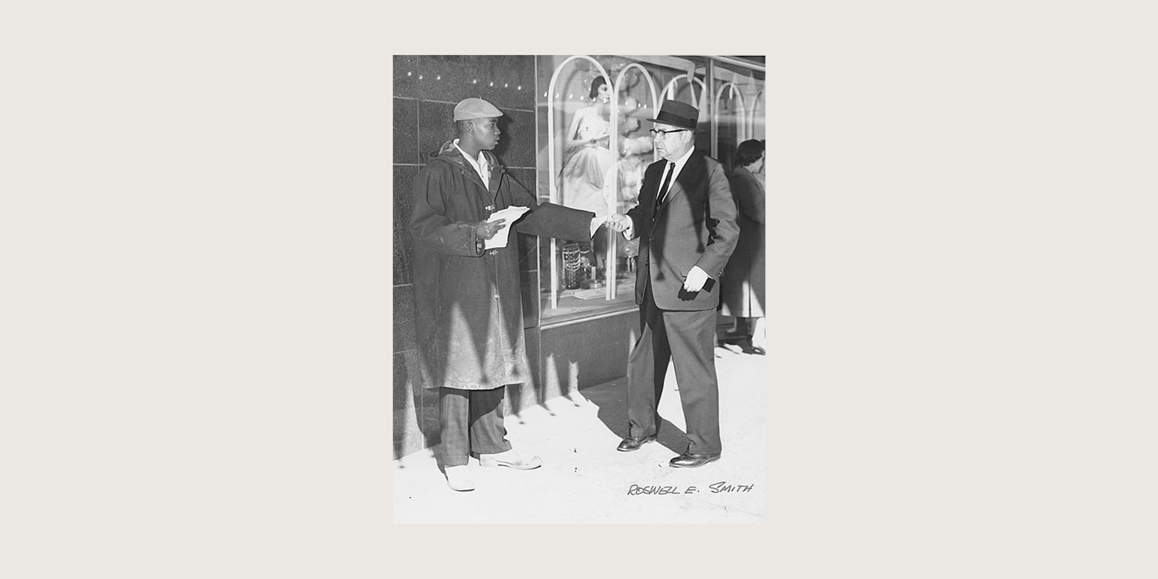 An unidentified student hands out flyers in front of Rich’s department store