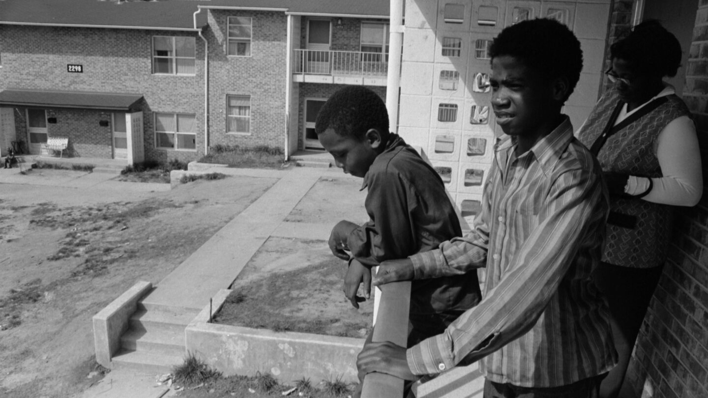 East Lake Meadows residents look out over their housing complex in 1973