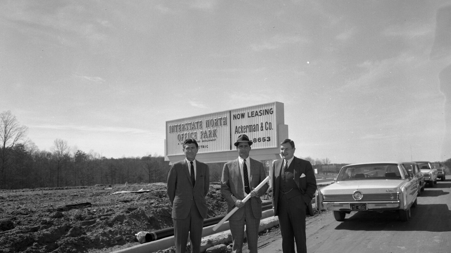 Tom Cousins, left, and two unidentified me