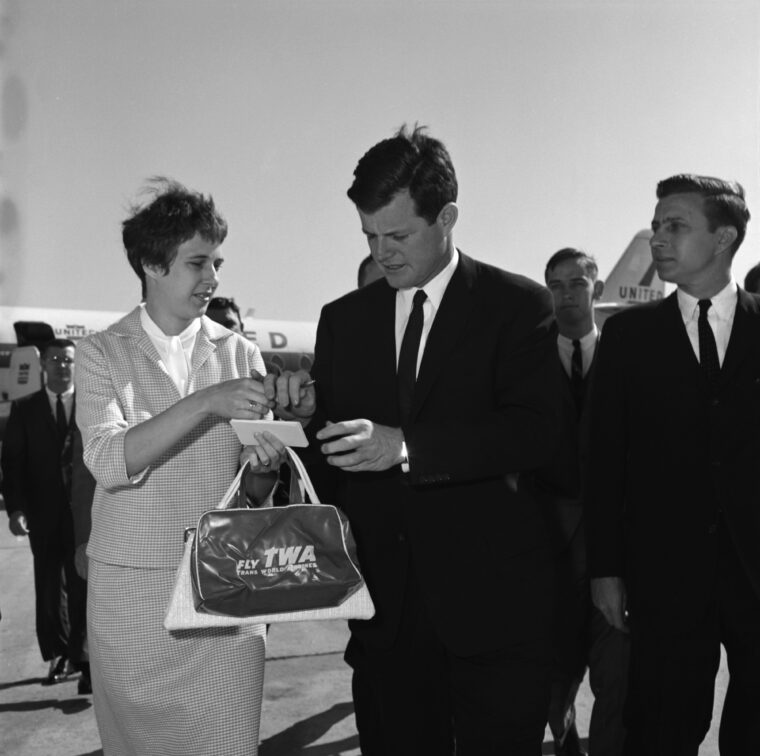 U.S. Senator Edward “Ted” Kennedy signs an autograph for Mrs. Jo Ann Player at the Atlanta airport during a campaign visit in 196