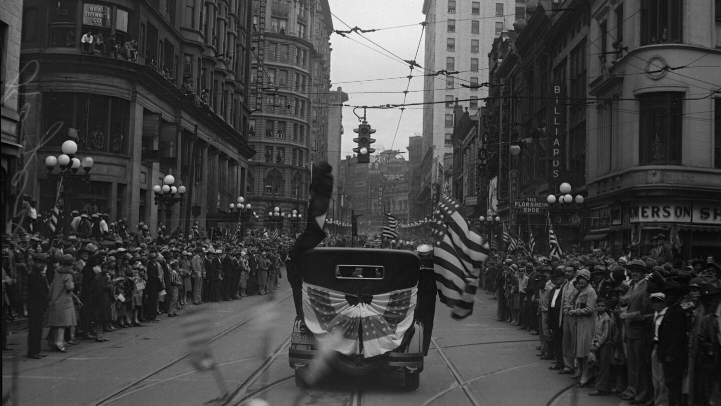 A crowd gathers on Peachtree Street during a parade held for aviator Charles Lindbergh in downtown Atlanta, Georgia