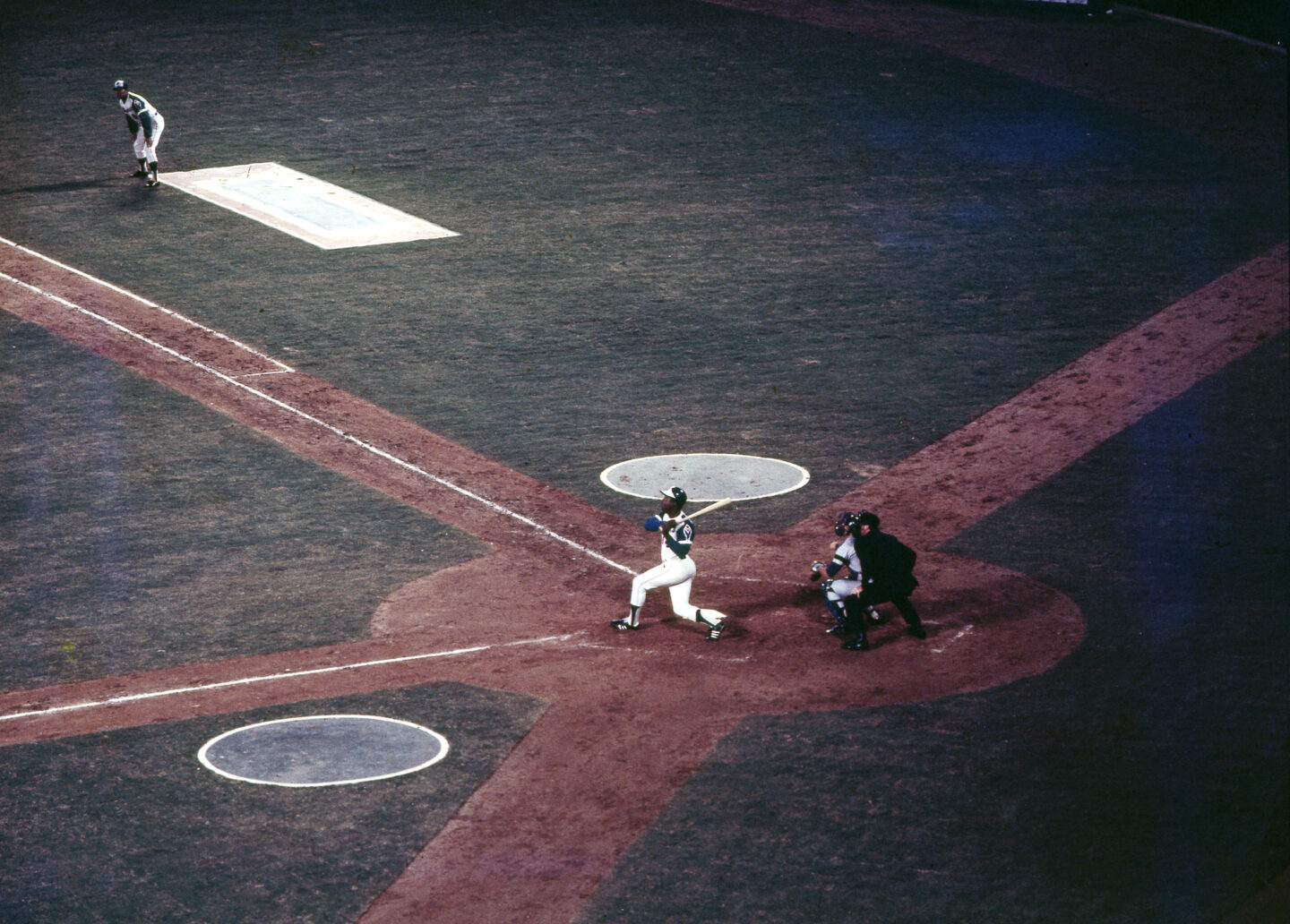 baseball field with hank aaron hitting the ball
