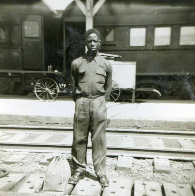 Hank Aaron in front of a train